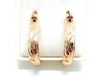 
              Gold hawaiian scroll earrings
            