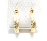 
              Gold hawaiian scroll earrings
            